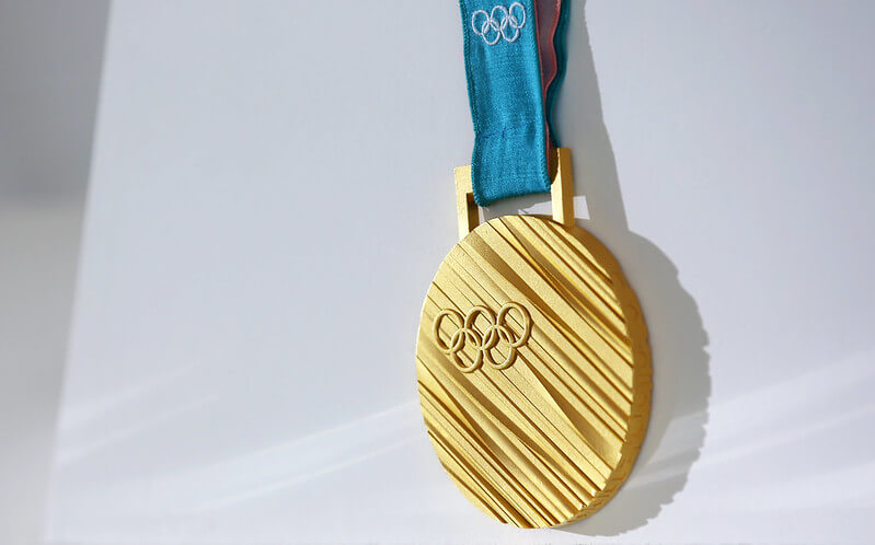 Un'immagine di una medaglia olimpica, che rappresenta il successo e l'eccellenza nello sport.